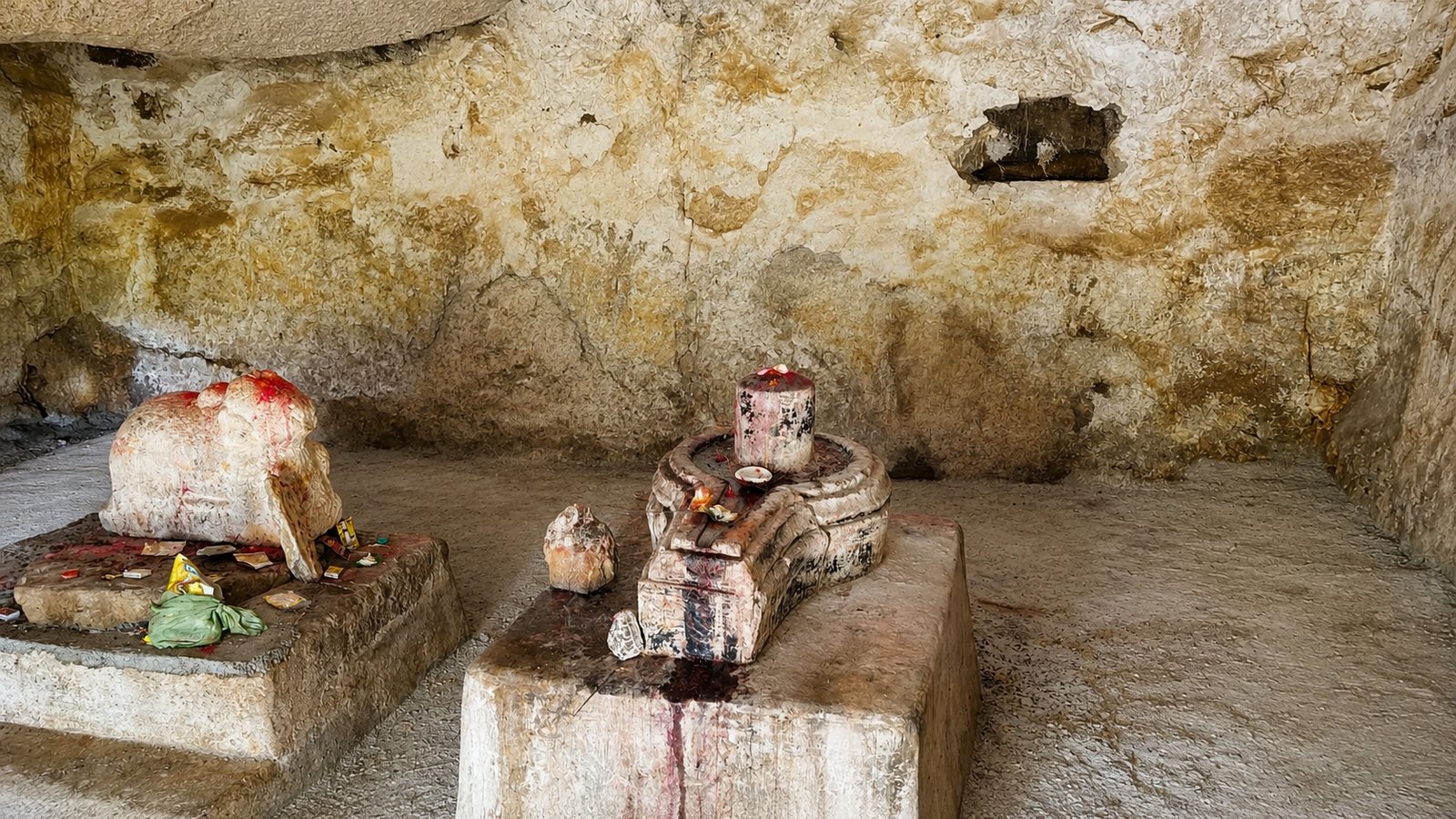 A rock-shelter Shiva shrine with linga and Nandi