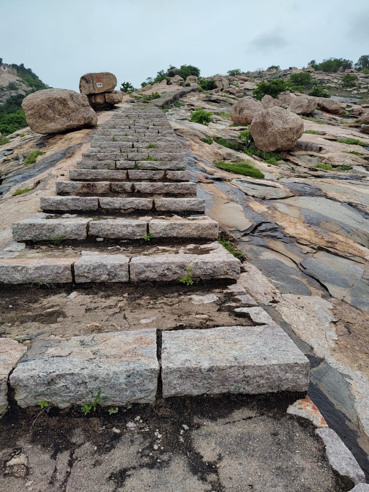 The incomplete stone steps up the hill